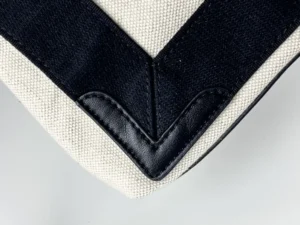 Yves Saint Laurent Tote bag beige black canvas leather trim corner close-up