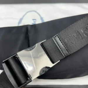 Prada belt black nylon fabric silver-tone metal buckle designer accessory