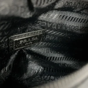 Prada bag interior black jacquard fabric lining with silver Prada logo plaque