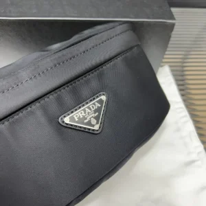 Prada shoulder bag black nylon compact design with triangular metal logo plaque