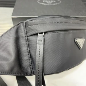Prada nylon belt bag black fabric with leather zipper pulls and triangular logo badge