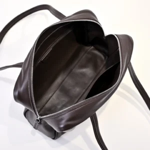 Common Projects backpack medium dark brown leather with silver zipper and interior pocket