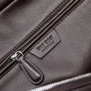 The Row leather bag dark brown smooth leather interior zipper pocket close-up