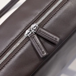 Prada leather duffle bag dark brown pebbled leather silver zipper detail