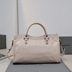 Balenciaga Classic City bag medium textured leather in light beige with top handles and detachable shoulder strap