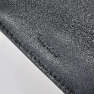 The Row leather accessory black smooth grain embossed logo