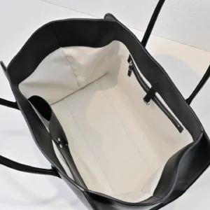 Saint Laurent Shopping tote black leather bag with white fabric interior and zipper pocket