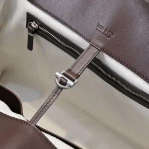 The Row Margaux 36 brown calf leather tote bag with silver hardware and canvas interior lining