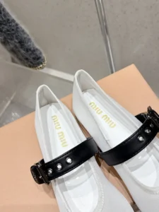 Miu Miu Mary Jane flats white fabric black leather strap silver stud details sneakers