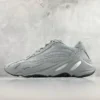 Gray sneaker with unique design.