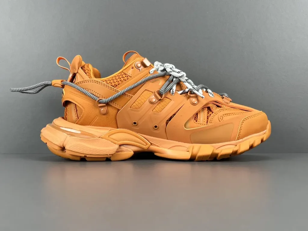 Balenciaga Track 2 mustard yellow mesh leather sneakers with looped shoelace design and layered sole
