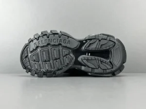 Balenciaga Track black rubber sole sneakers with embossed brand logo and rugged tread pattern