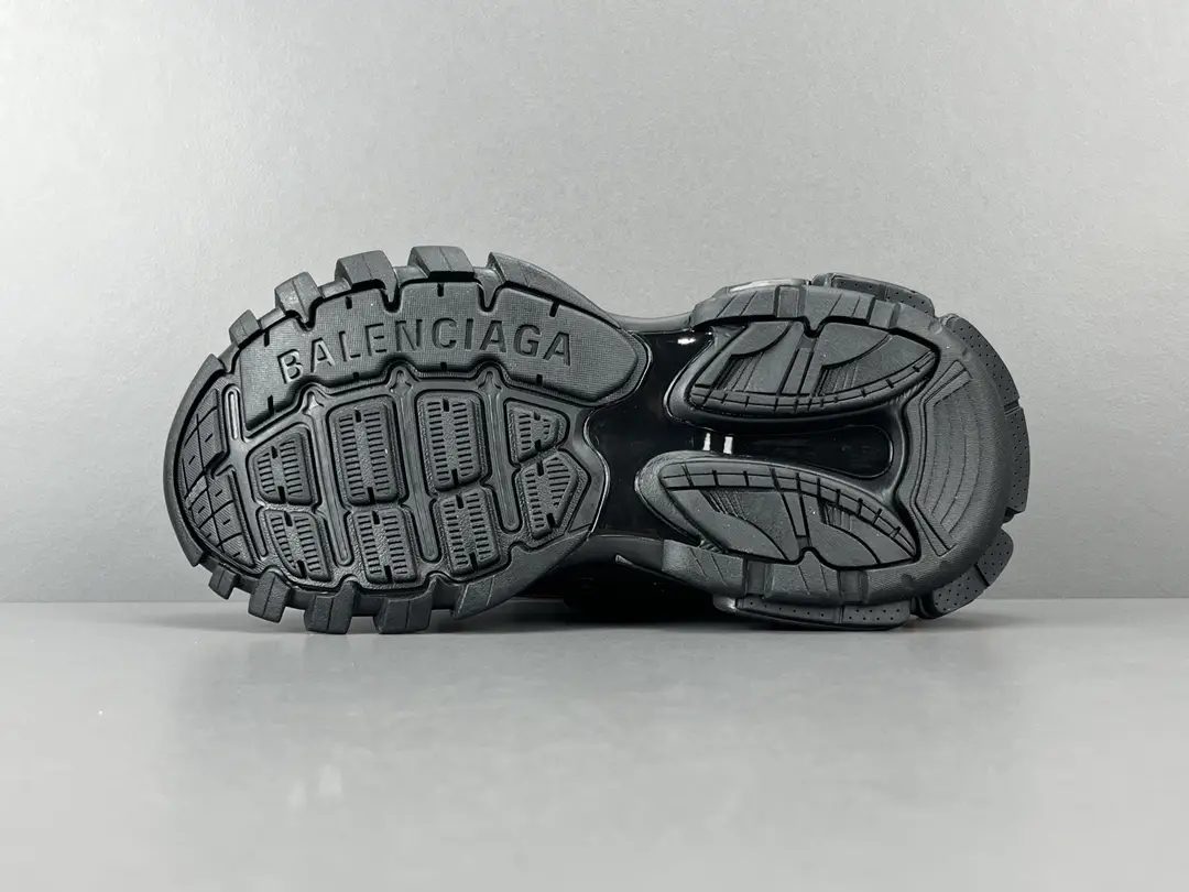 Balenciaga Track black rubber sole sneakers with embossed brand logo and rugged tread pattern