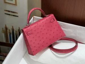 Hermès Kelly 25 ostrich leather handbag pink silver hardware detachable strap