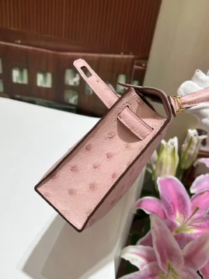 Hermès Kelly Mini 20 pink ostrich leather handbag with gold hardware and top handle