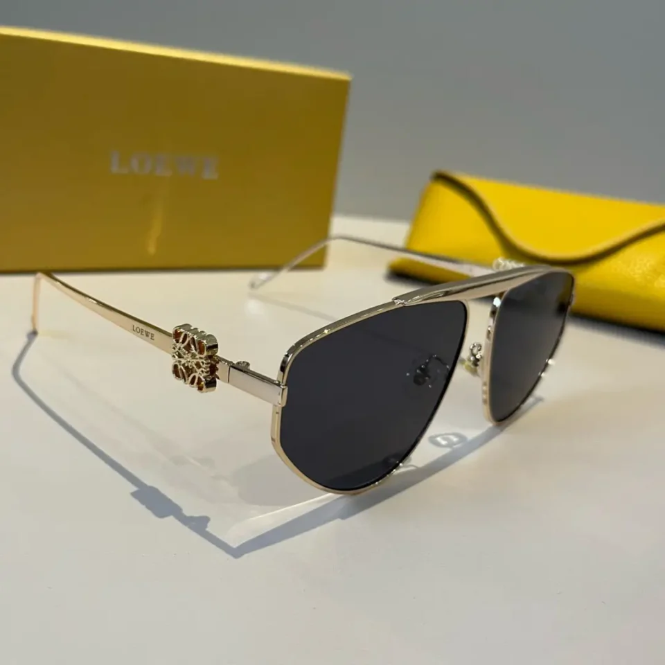 Loewe sunglasses aviator style black lenses gold metal frame with logo detail and yellow leather case