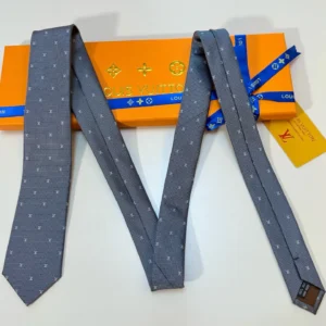 Louis Vuitton necktie gray silk fabric with subtle monogram pattern and signature packaging box