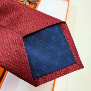 Hermes tie red patterned silk with blue H logo lining luxury accessory