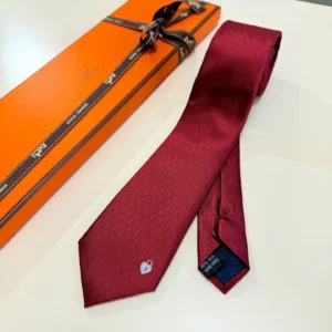Hermès tie burgundy silk fabric subtle check pattern with iconic lock embroidery and gift box packaging