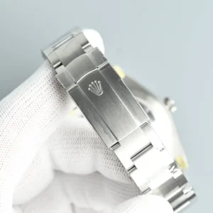 Rolex Submariner 116610LN silver stainless steel bracelet with clasp on white glove hand