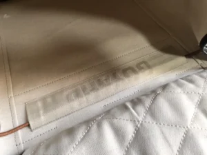 Louis Vuitton bag interior label beige canvas fabric with quilted pattern and leather trim