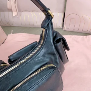 Miu Miu City calf leather bag black leather gold-tone zipper hardware medium size