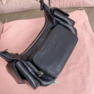 Miu Miu small black leather crossbody bag with embossed logo and gold zipper hardware