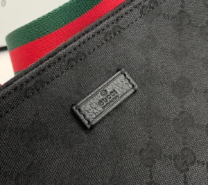 Gucci messenger bag black GG canvas red green fabric strap leather trim
