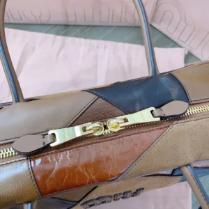 Miu Miu patchwork leather handbag tan brown black colorblock suede with gold zipper detail