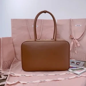 Miu Miu leather handbag medium brown smooth leather with top handles and zip closure