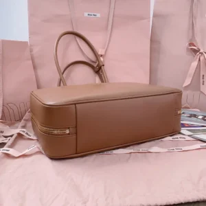 Miu Miu leather tote bag tan medium size smooth leather with double handles and gold zipper detail