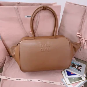 Miu Miu bowler bag medium beige smooth leather with embossed logo and double top handles