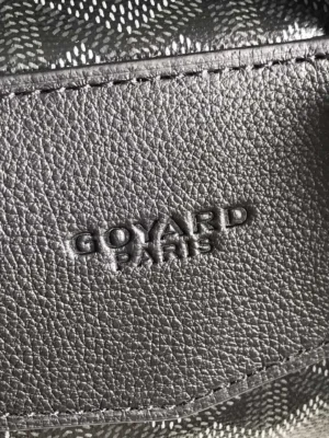 Goyard leather bag black textured leather with embossed brand logo close-up detail