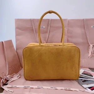 Miu Miu bowler bag medium yellow suede leather with double handles and zip closure