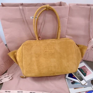 Miu Miu tote bag medium mustard yellow suede with top handles and embossed logo detailing