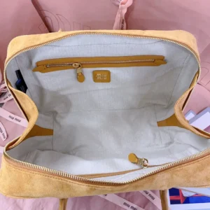 Miu Miu handbag medium beige suede bag with zippered interior pocket and fabric lining