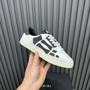 Amiri MC01 white black leather suede sneakers with textured rubber sole and stitched logo detailing