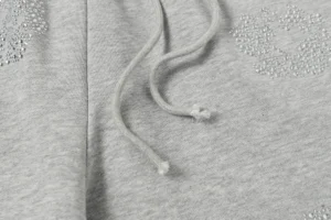 Repsgoat gray hoodie cotton fabric with drawstrings and rhinestone embellishments close-up detail