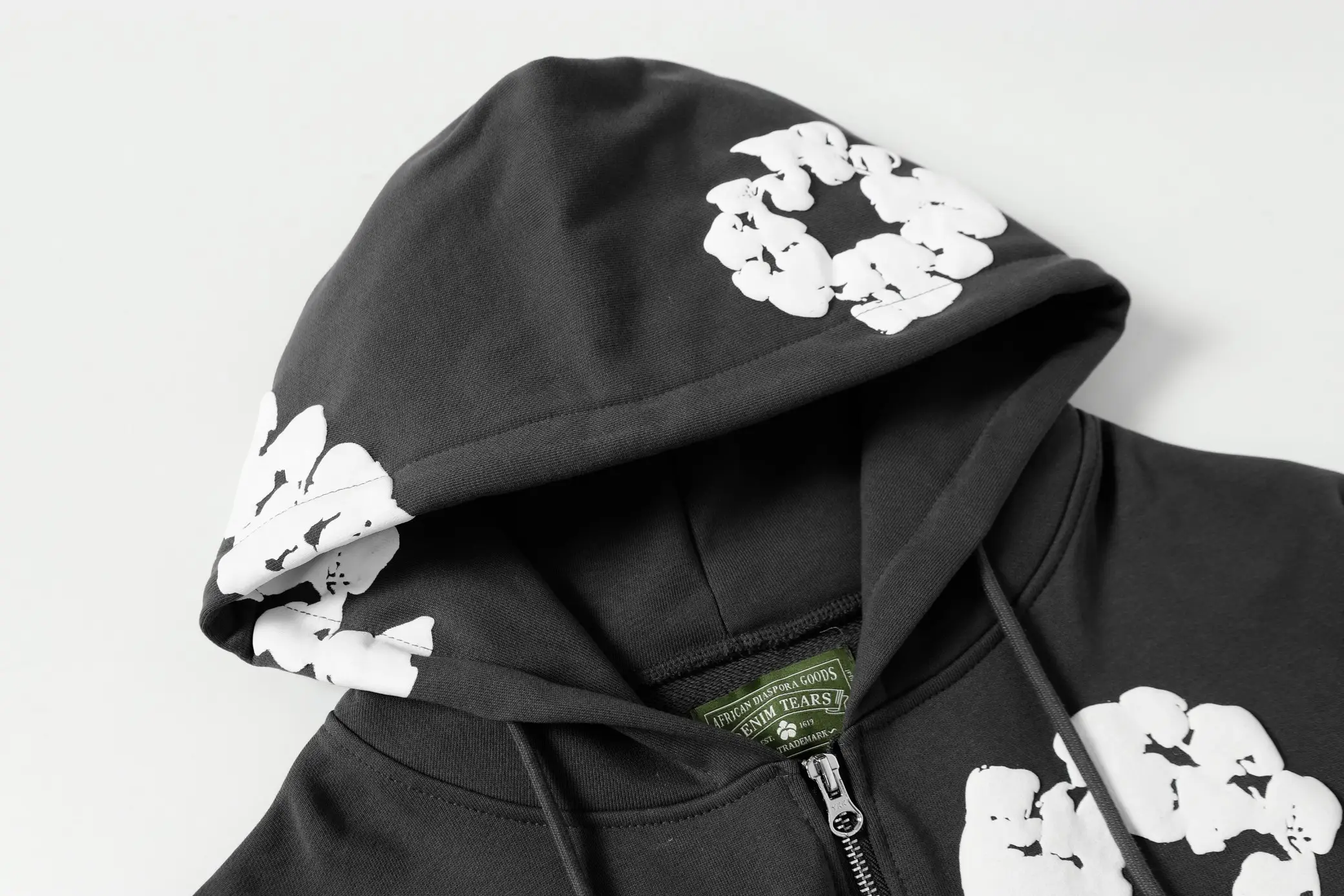 Denim Tears hoodie black cotton with white floral print and full zipper closure