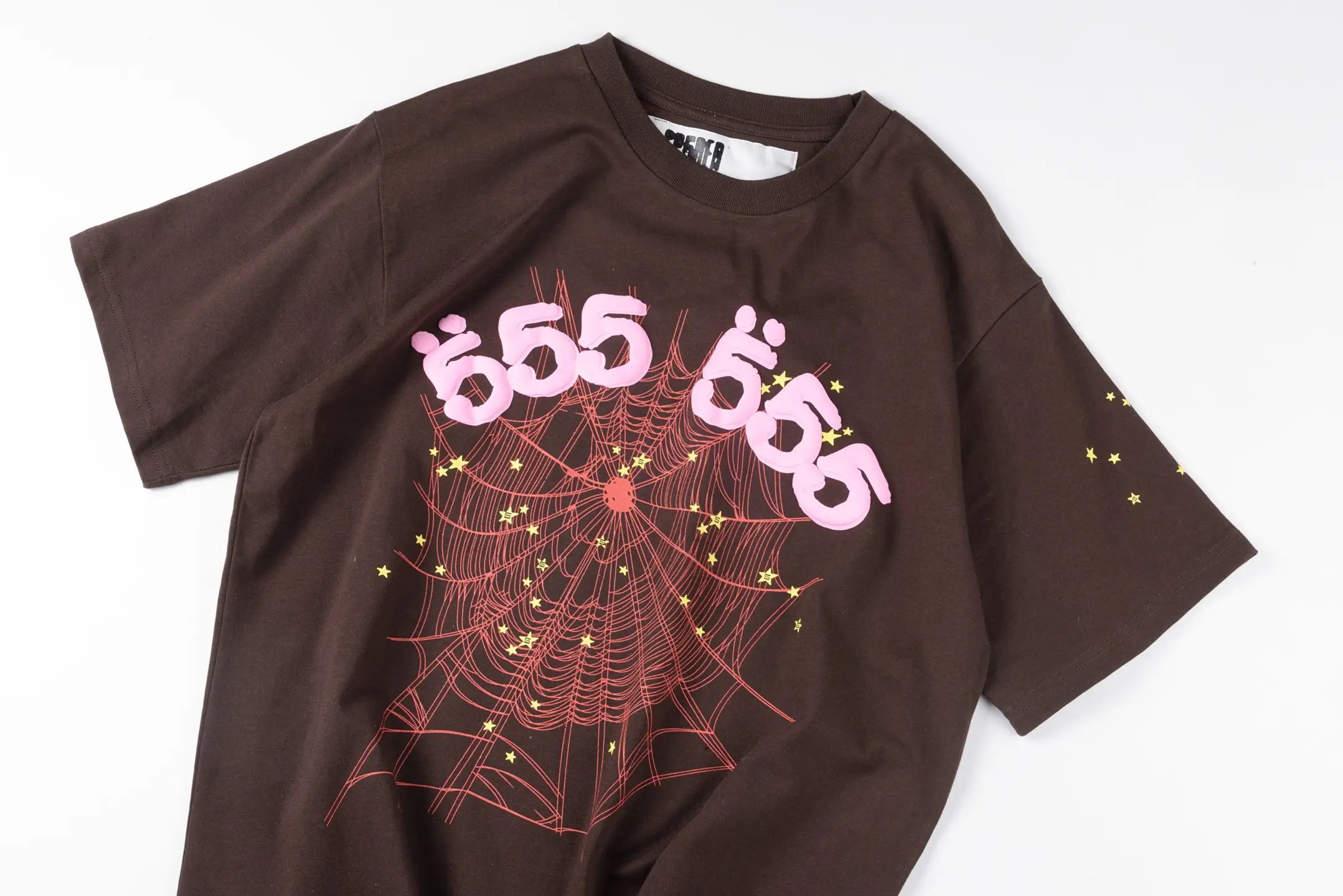 555 Brown T-shirt with pink graphic web design and yellow star accents cotton material