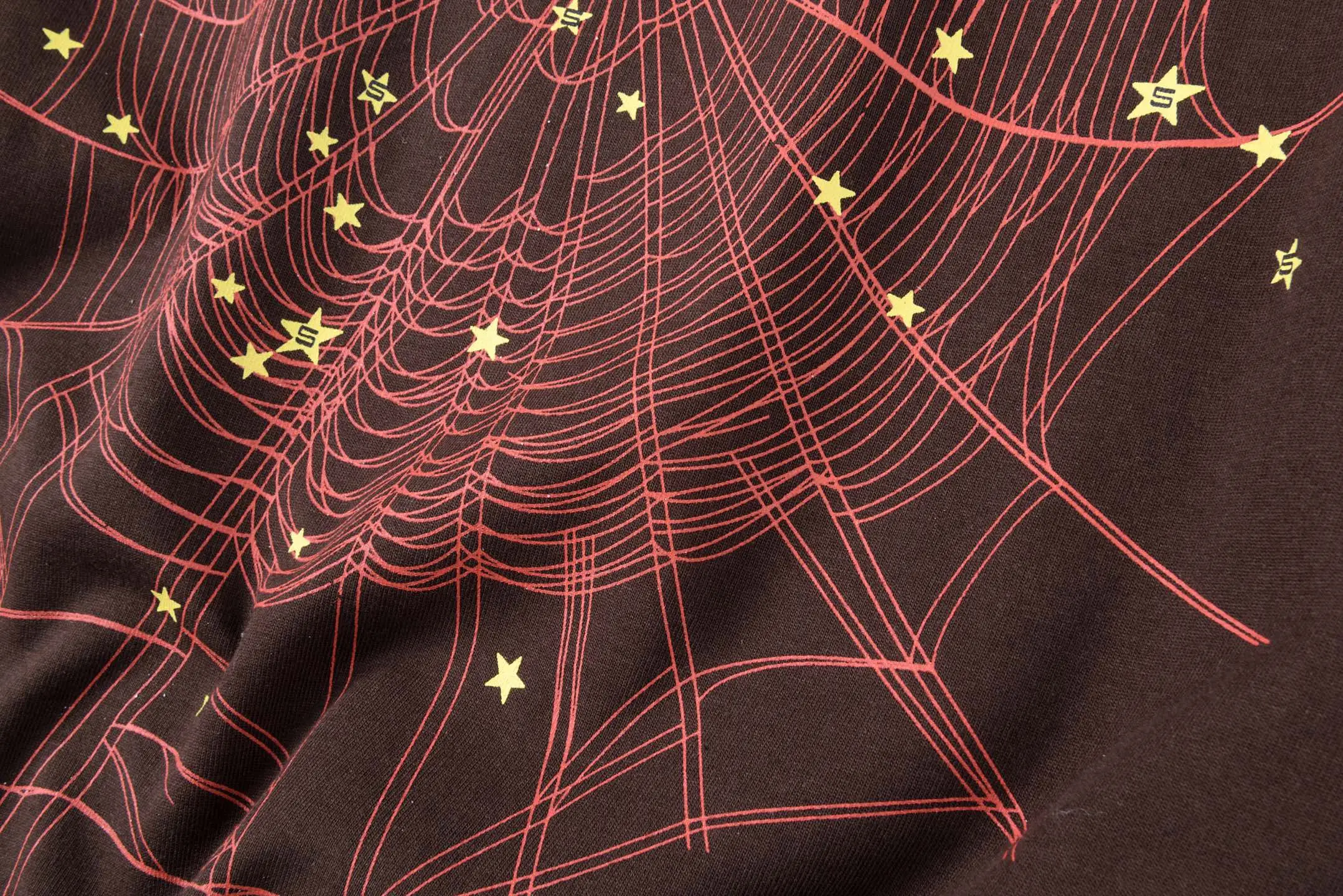 Unknown brand spider web graphic print t-shirt black cotton material with yellow star accents