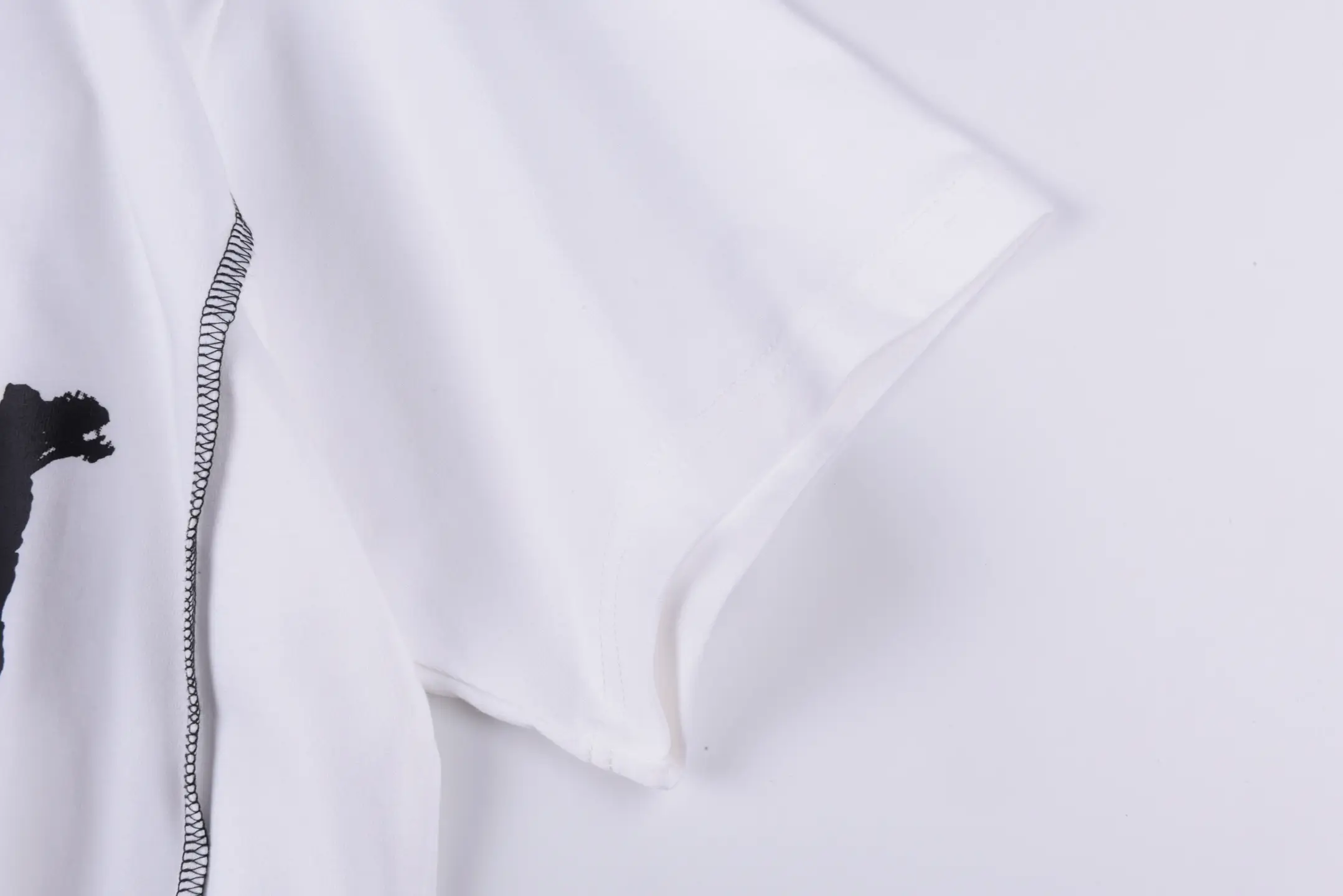 Repsgoat white short sleeve T-shirt cotton fabric with black stitching detail close-up