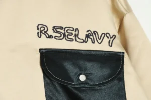 R.Selavy jacket beige with black satin buttoned pocket embroidered logo cotton blend material