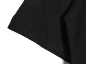RepsGoat black cotton T-shirt close-up of short sleeve stitching detail
