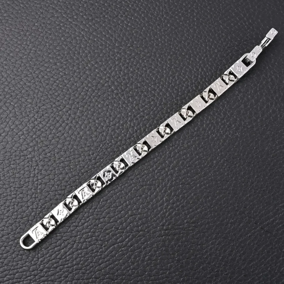 Louis Vuitton chain link bracelet silver metal with engraved monogram pattern and clasp closure