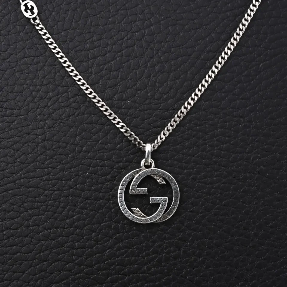 Gucci necklace silver chain pendant with interlocking GG logo textured metal accessory