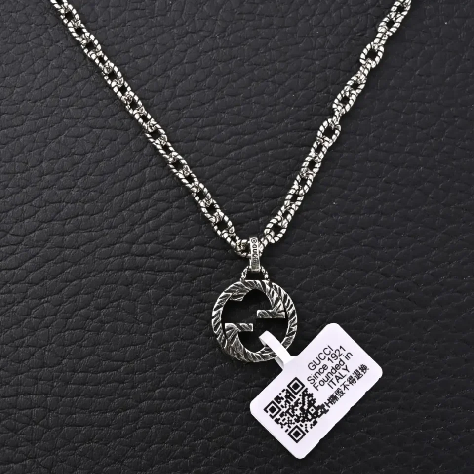 Gucci necklace silver-tone metal chain with textured double G pendant and engraved logo tag