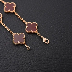 Van Cleef & Arpels Alhambra bracelet red agate clover rose gold chain accessory with lobster clasp closure