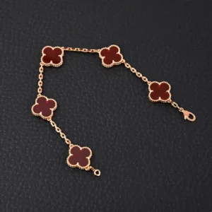 Van Cleef & Arpels Alhambra bracelet red carnelian clover rose gold chain accessory