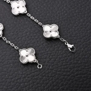 Van Cleef & Arpels Alhambra bracelet silver floral motifs white gold jewelry accessory